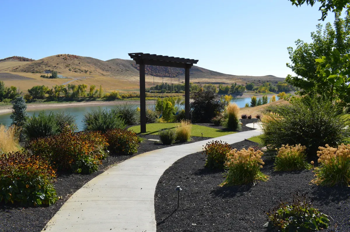 Outdoor living space with integrated hardscapes in Cache Valley